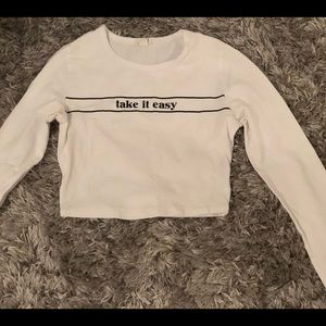 white graphic long sleeve shirt